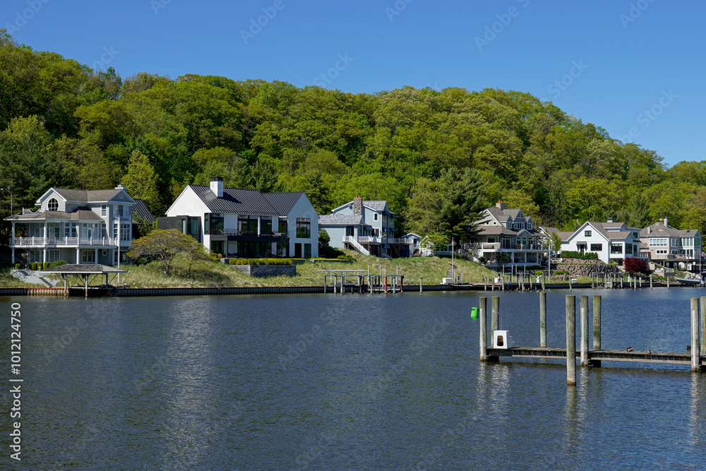 Houses along a riverfront in Michigan Houses along a riverfront in Michigan