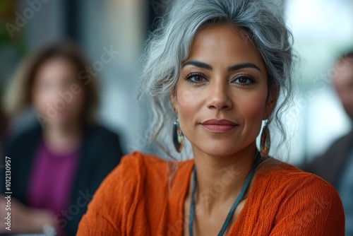 Portrait of ethnic female manager talking to creative team in business meeting at modern office, Generative AI