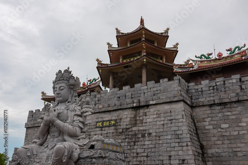 Chinese temple complex Patung Seribu (Vihara Ksitigarbha Bodhisattva, 500 Lohan Temple) on Bintan Island, Indonesia, Asia. Tanjung Pinang. Iconic buddhist landmark with giant Buddha statue and pagoda photo