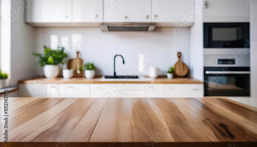 A blurred view of a modern kitchen with white furniture and a wooden table, creating a soft, contemporary atmosphere perfect for home and interior design visuals