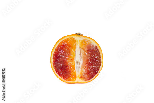 Ripe Sicilian orange half isolated over white background. Copy space. Close up view