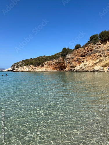 Crete, Greece - September 26, 2023: Beautiful colorful beach at Crete island, Greece. Voulisma paradise beach with rocks and mountains. Summer vacation travel holiday background concept. photo