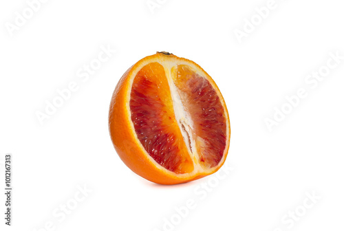 Ripe Sicilian orange half isolated over white background. Copy space. Close up view