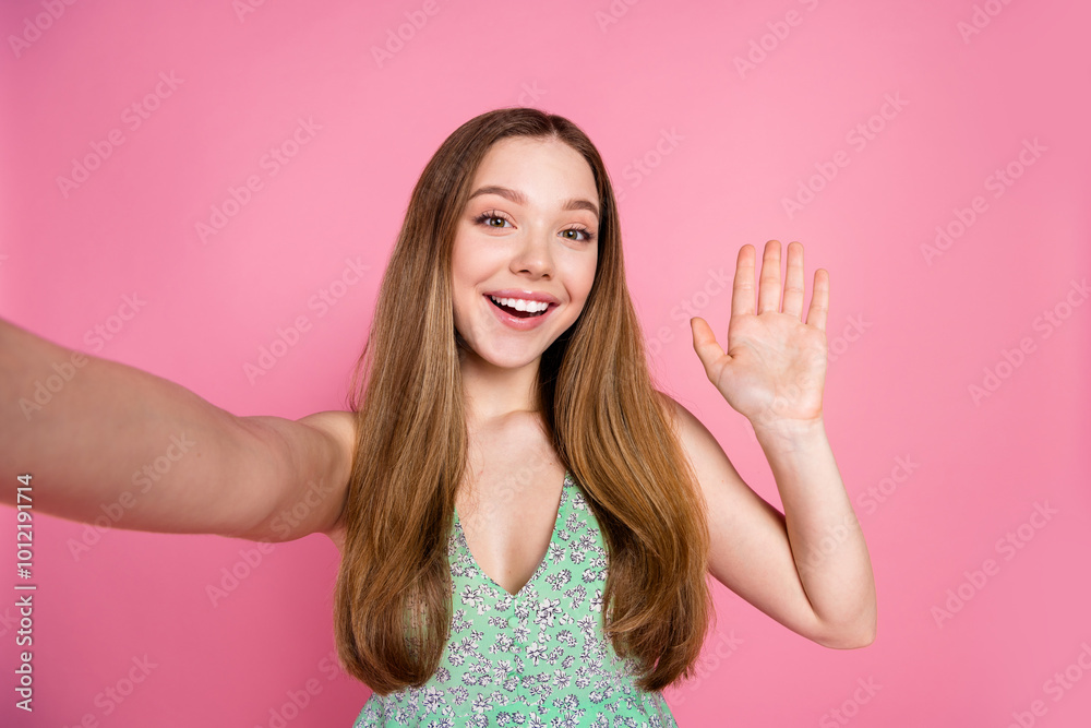 Portrait of nice young woman selfie arm wave hi wear singlet isolated on pink color background Portrait of nice young woman selfie arm wave hi wear singlet isolated on pink color background