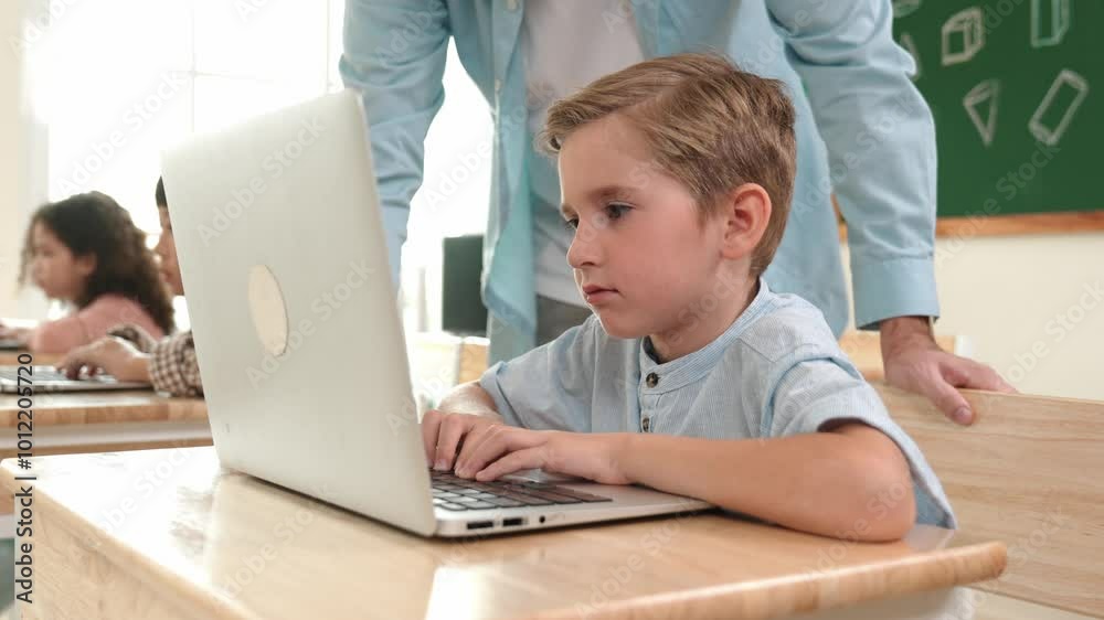 Caucasian teacher helping energetic boy coding engineering prompt while diverse student using software generated AI. Children sitting and programing system. Cute student learning about code. Pedagogy. Caucasian teacher helping energetic boy coding engineering prompt while diverse student using software generated AI. Children sitting and programing system. Cute student learning about code. Pedagogy.