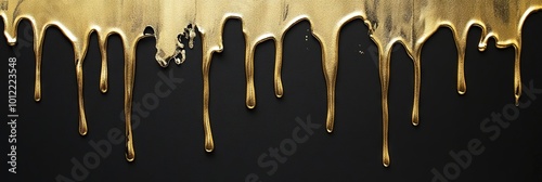 liquid gold paint dripping on black wall