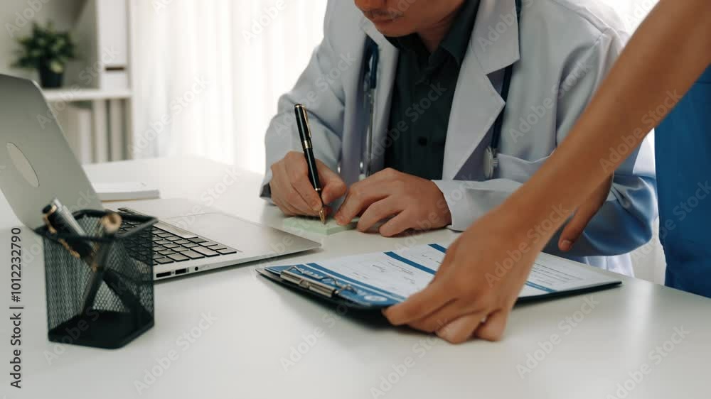 Professional various team of healthcare worker working and planning medical treatment at hospital table together. Teamwork lead to successful illness and sickness treatment. Slow motion. Rigid. Professional various team of healthcare worker working and planning medical treatment at hospital table together. Teamwork lead to successful illness and sickness treatment. Slow motion. Rigid.