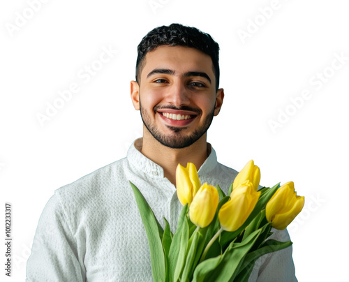 Smiling man holding a bouquet of yellow tulips against a bright blue backgrou...