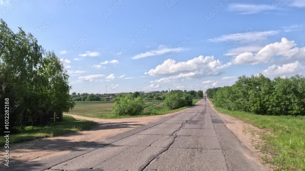 Road view on a summer day. Highways, roadside and white road line markings. Road view on a summer day. Highways, roadside and white road line markings.