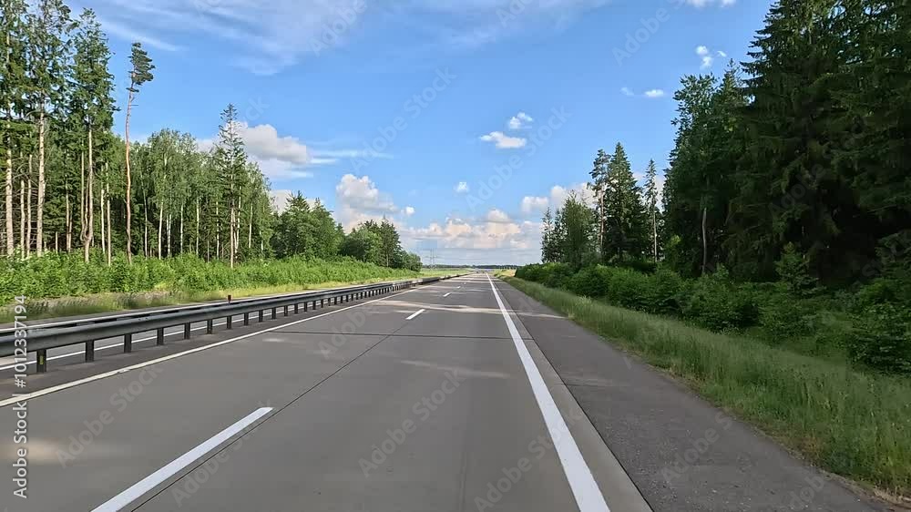Road view on a summer day. Highways and cars, roadside and white road line markings. Road view on a summer day. Highways and cars, roadside and white road line markings.