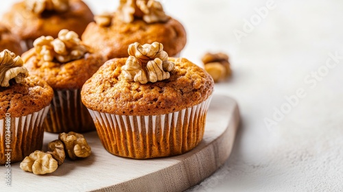 Pumpkin spice muffins with walnuts, white background. generative ai