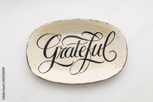 Rustic ceramic plate with elegant 'Grateful' calligraphy