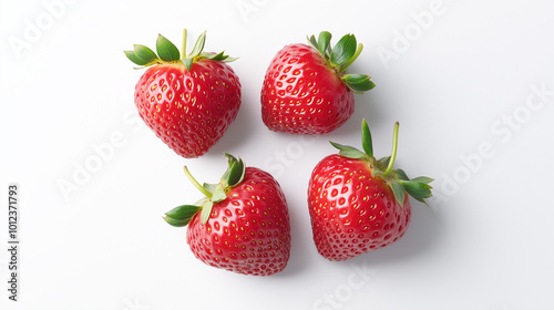 Four fresh strawberries with vibrant red color and green leaves are arranged on white background.