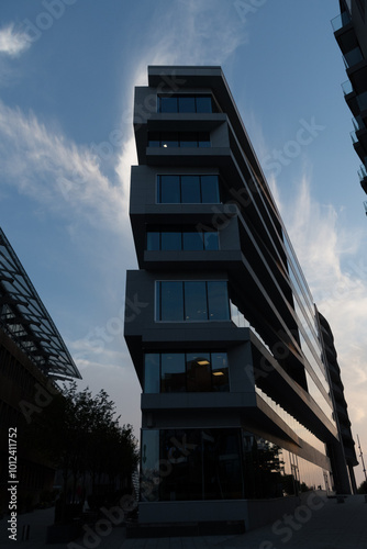 Sunset shadows and highlights over narrow condo building in Tjuvholmen photo