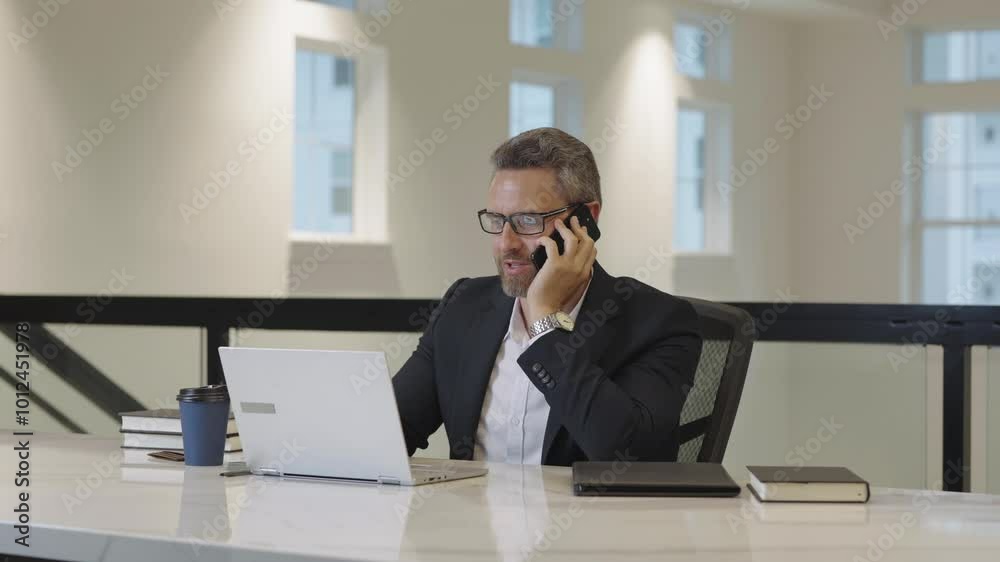 Office worker talking on phone at office. Employee talking on phone. Phone meeting. Business man using phone. Ceo manager chatting on smartphone. Business talk. Man solving problems on smartphone. Office worker talking on phone at office. Employee talking on phone. Phone meeting. Business man using phone. Ceo manager chatting on smartphone. Business talk. Man solving problems on smartphone.