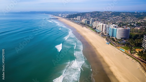 A breathtaking view of the ocean, capturing the serene beauty of the sea. The image showcases vibrant blue waters with gentle waves lapping against the shore,