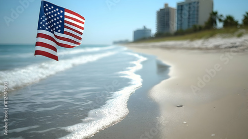 American Flag Waves on Sandy Beach with Ocean Waves