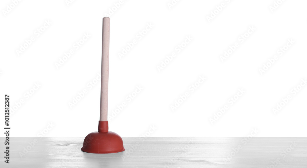 Plunger on white wooden table. Pipe cleaning tool Plunger on white wooden table. Pipe cleaning tool