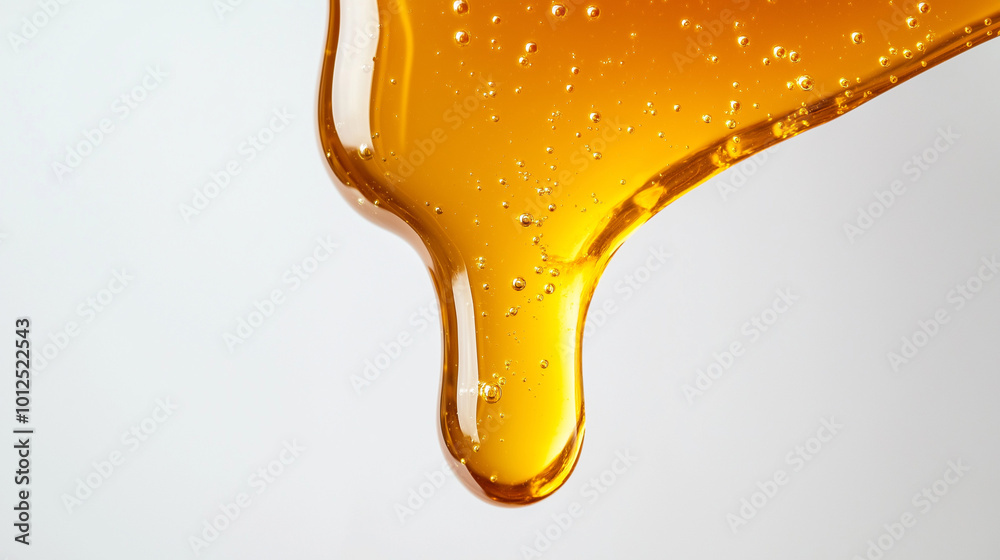 close-up, front view, the image of honey dripping on a white background close-up, front view, the image of honey dripping on a white background