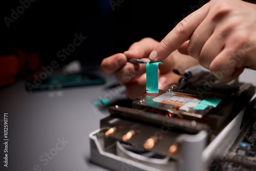 Hand Repairing a Graphics Card through the Application of Thermal Paste for Better Performance