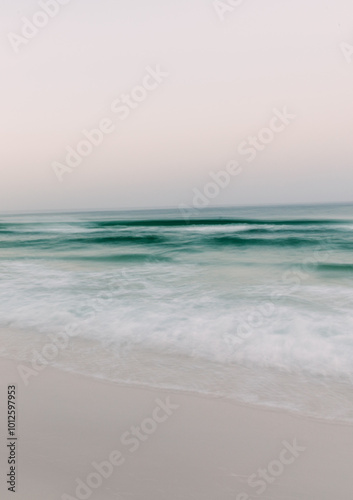 soft receding waves and beach at sunrise in Seaside, Florida