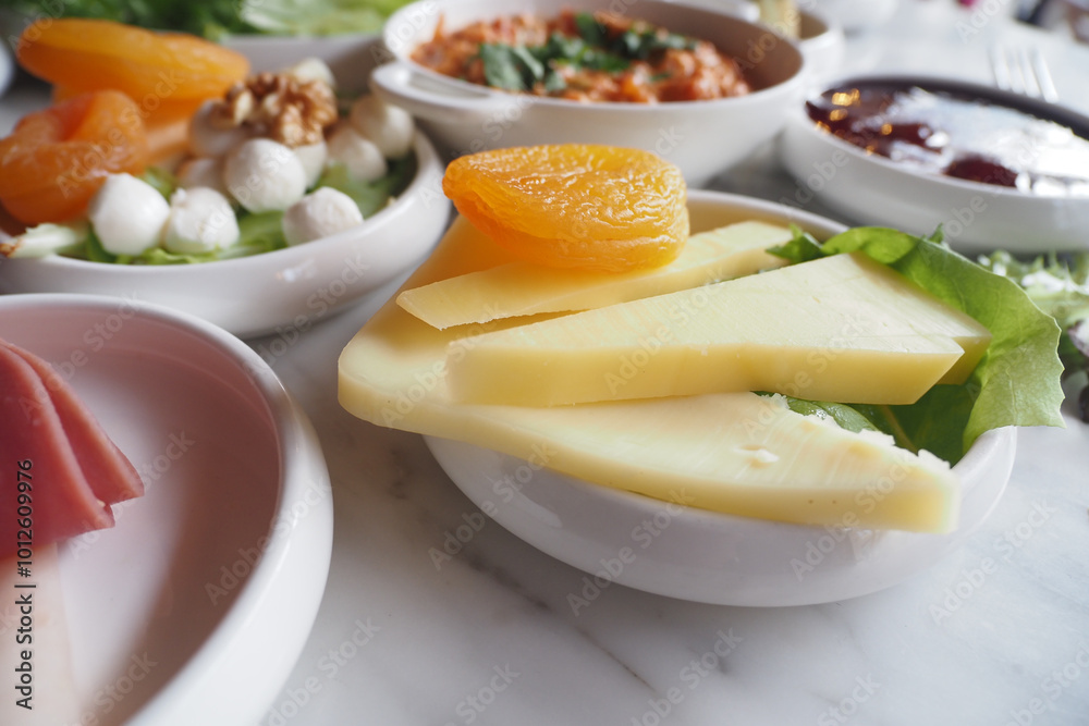 A delightful selection of assorted appetizers with cheese and fresh ingredients for any event