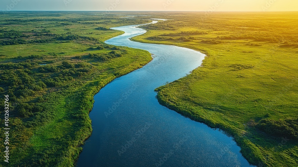 Aerial view of a winding river through the landscape, captured from above, emphasizing the beauty of nature's patterns Aerial view of a winding river through the landscape, captured from above, emphasizing the beauty of nature's patterns
