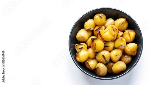 Chinese water chestnut - Eleocharis dulcis - is a grass like sedge. the small, rounded corms have a crisp, white flesh and may be eaten raw, slightly boiled, or grilled, and often are pickled photo