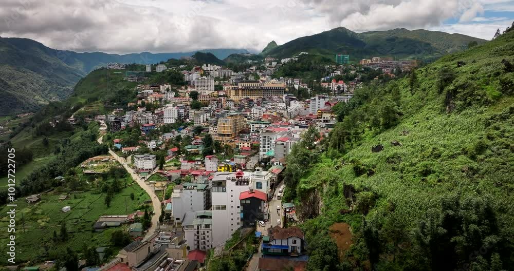 Sa Pa town surrounded by mountain landscape under the cloudy sky, Establishing drone shot Sa Pa town surrounded by mountain landscape under the cloudy sky, Establishing drone shot