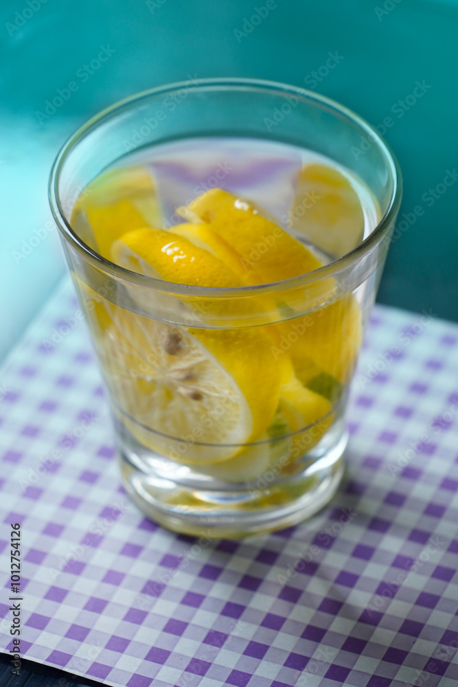 glass of water with lemon in gradient fresh green baackground glass of water with lemon in gradient fresh green baackground