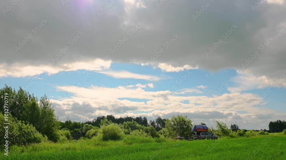 Clouds are moving fast over a green field Clouds are moving fast over a green field