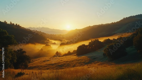 A serene sunrise over a misty valley, showcasing nature's beauty and tranquility in an idyllic landscape setting.