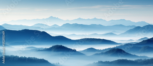 Majestic misty mountains at dawn with soft blue tones and layered peaks