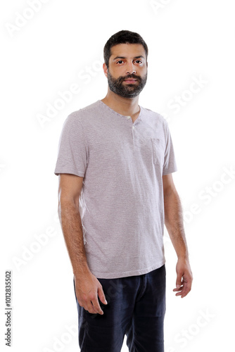 young man posing in casual clothes on neutral background