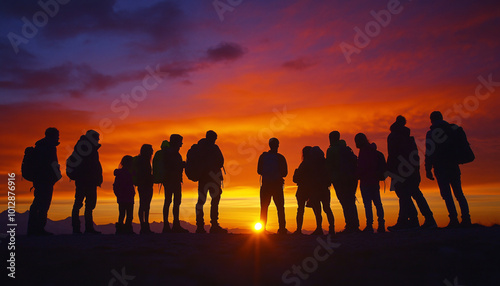Capture individuals in silhouette form against the rising sun, emphasizing the beauty of their shape and the vibrant sky