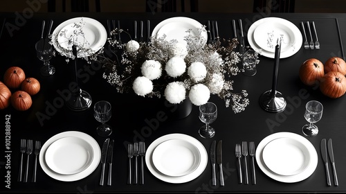 Elegant autumn table setting with white dishes and seasonal decor. photo