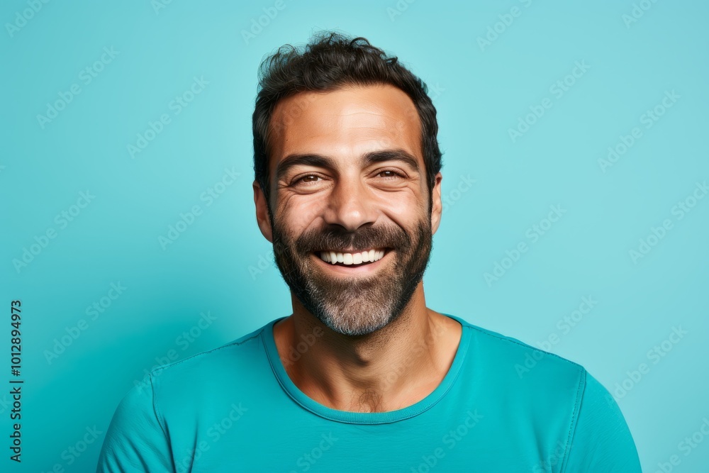 Handsome man with beard and mustache smiling over blue background. Handsome man with beard and mustache smiling over blue background.
