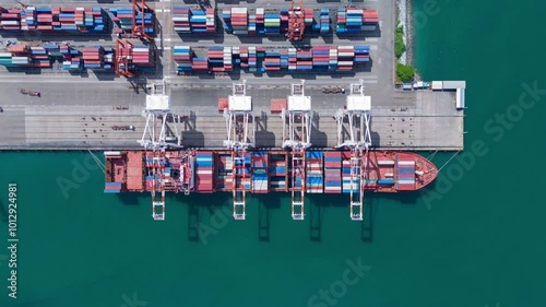 time lapse Cargo Container Ship at  international customs sea port. Crane loading cargo working at industry port. working freight shipping import export shipping concept.