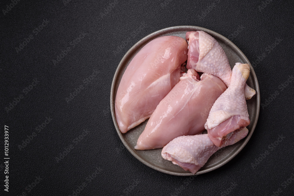 Pieces of raw chicken or turkey fillet with salt, spices and herbs Pieces of raw chicken or turkey fillet with salt, spices and herbs