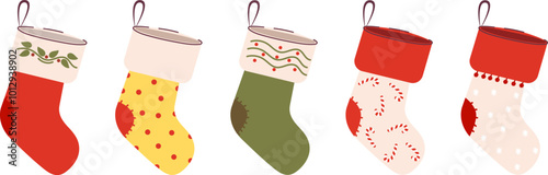 A set of cute Christmas stockings for gifts. A winter collection of red, green, socks with Christmas trees, snowflakes, candies.