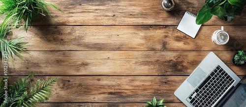 Wooden Desk Workspace with Laptop, Plants, and Coffee