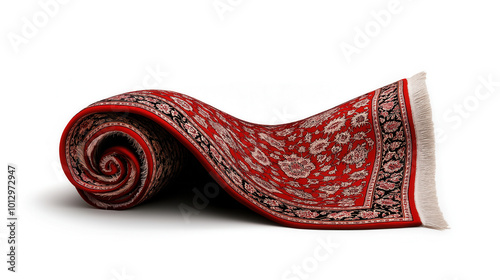 A rolled-up red carpet with intricate patterns on white background