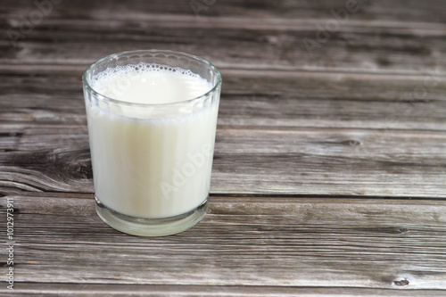 Glass of powdered dry milk, a manufactured dairy product made by evaporating milk to dryness to preserve it with longer shelf life, Powdered milk is used for food as an additive and as a drink