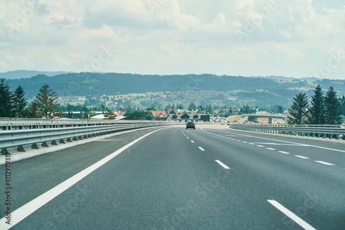 Highway road with cars and scenic background