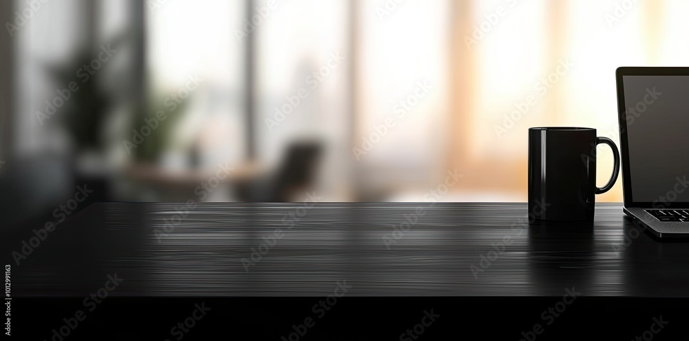 Laptop and coffee cup on black table in office. Workplace concept Laptop and coffee cup on black table in office. Workplace concept