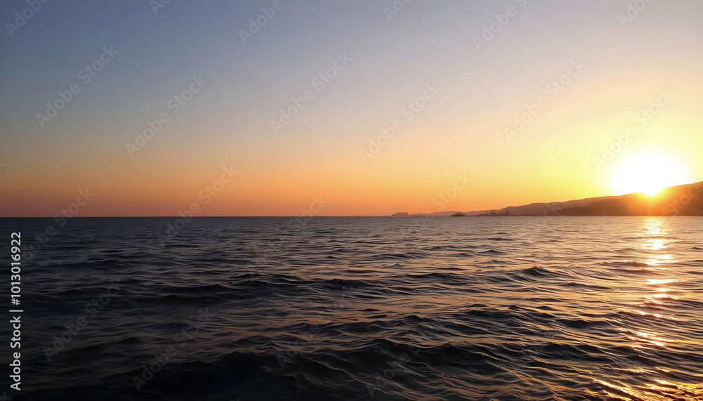 Fototapeta premium A peaceful sunset over the sea with warm golden hues reflecting on the water, creating a tranquil atmosphere perfect for relaxation and beachside retreats.