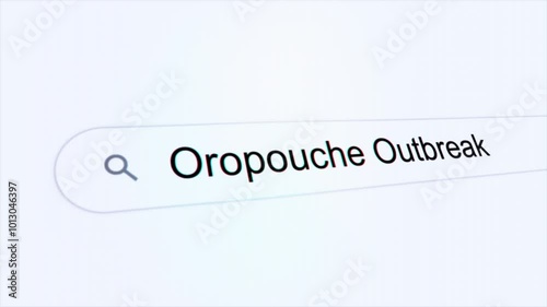 Oropouche Outbreak typing on internet search bar computer screen photo