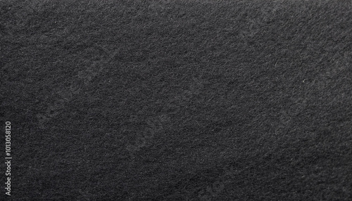 Black felt material. Surface of felted fabric texture abstract background in dark gray color.