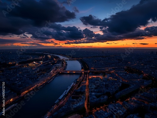 Dramatic Sunset Over a Cityscape with a River and Bridges, Vibrant Colors and Dramatic Clouds Creating a Stunning Urban Landscape.