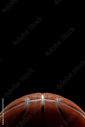 Close up of a basketball ball isolated on black background. Sport bets in betting shops. Copy space.